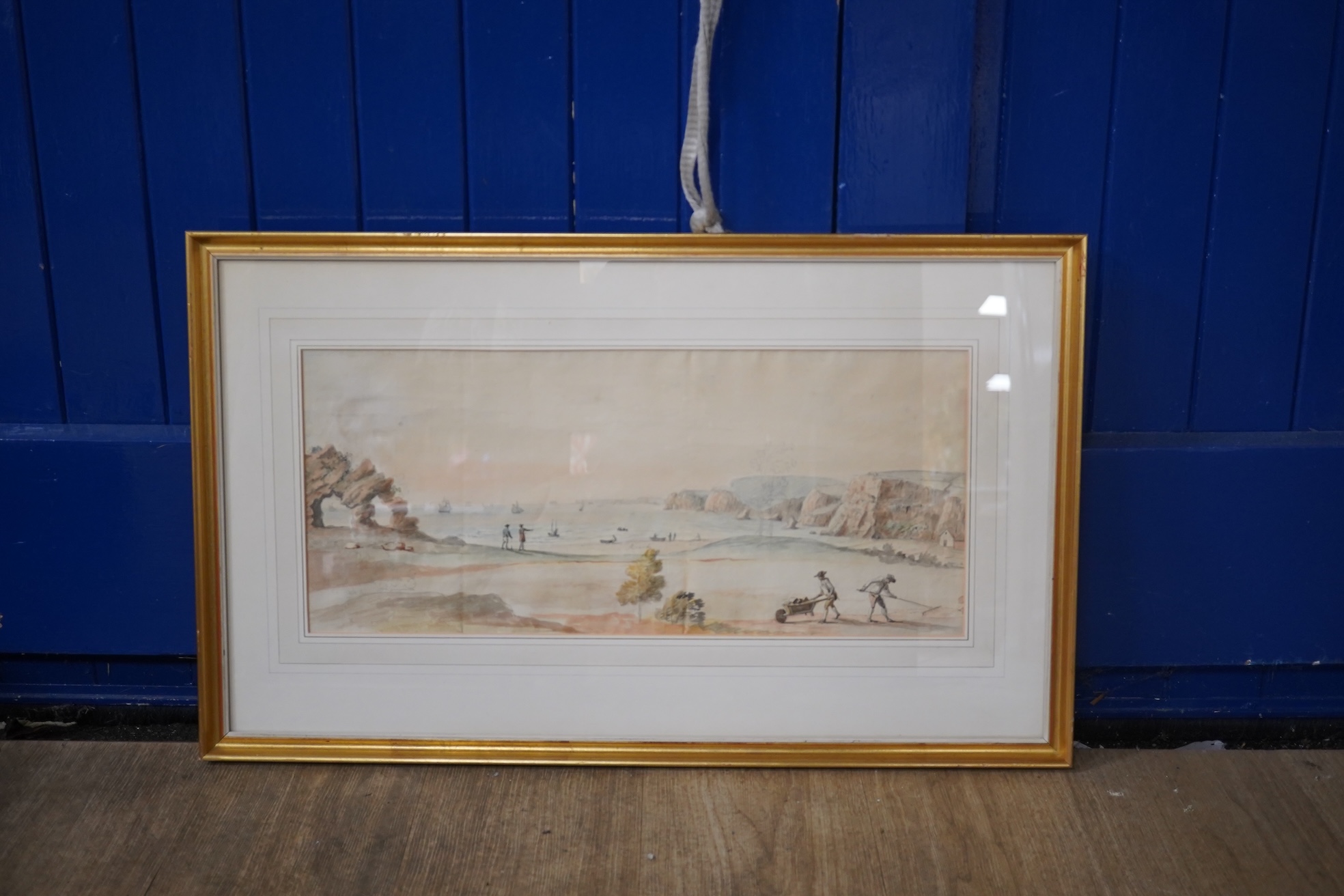 18th century, English School, ink and watercolour, Landscape with figures on beach, gardeners in the foreground, unsigned, 23 x 54cm. Condition - poor